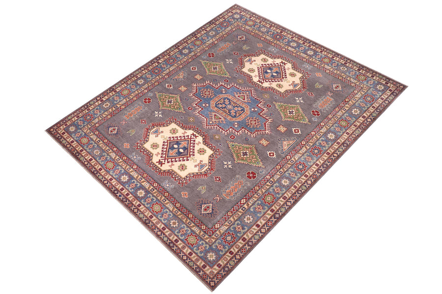Hand-knotted Kazak rug styled in a living room, 8x10